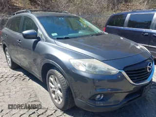 2015 Mazda CX-9 Touring with VIN JM3TB3CV1F0461854, listed as a IAAI auction lot 42068299 with 128,124 mi miles. Bid and sale history available at carsss.com. Image 1.