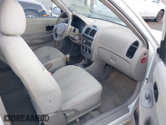 2004 Hyundai Accent GL with VIN KMHCG35C74U303431, listed as a IAAI auction lot 41725717 with 211,893 mi miles. Bid and sale history available at carsss.com. Image 5.