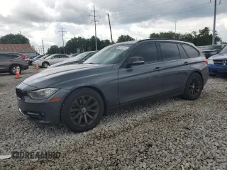 2014 BMW 3 Series 328d xDrive with VIN WBA3K5C59EKT33205, listed as a Copart auction lot 65216574 with 202,927 mi miles and Salvage title. Bid and sale history available at DreamBid. Image 1.