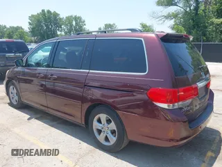 2010 Honda Odyssey Touring z VIN 5FNRL3H92AB010292, wystawiony jako IAAI lot #42469216 z przebiegiem 188 921 mil mil oraz . Historia ofert i sprzedaży dostępna na DreamBid. Obrazek 3.