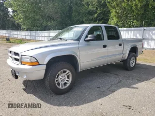 2003 Dodge Dakota Sport z VIN 1D7HG38N23S309001, wystawiony jako Copart lot #56595945 z przebiegiem 130 864 mil mil oraz Szkoda całkowita • Salvage title. Historia ofert i sprzedaży dostępna na DreamBid. Obrazek 1.
