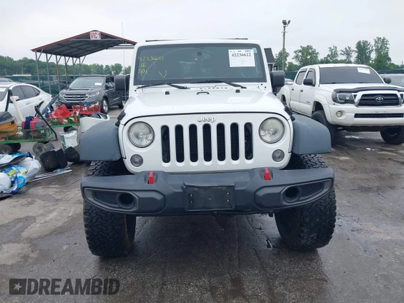 2014 Jeep Wrangler Unlimited Rubicon with VIN 1C4HJWFG4EL104827, listed as a IAAI auction lot 42236622 with 90,935 mi miles and . Bid and sale history available at DreamBid. Image 13.