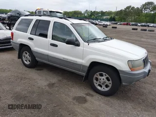 2000 Jeep Grand Cherokee Laredo z VIN 1J4GW48S2YC390226, wystawiony jako IAAI lot #42326715 z przebiegiem 273 806 mil mil oraz . Historia ofert i sprzedaży dostępna na DreamBid. Obrazek 1.