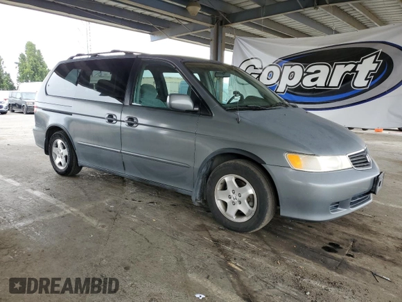 2000 Honda Odyssey EX с VIN 2HKRL1867YH555314, выставлен на аукционе Copart как лот 61065505 с пробегом 165 993 миль миль и Списание • Salvage title. История ставок и продаж доступна на DreamBid. Изображение 4.