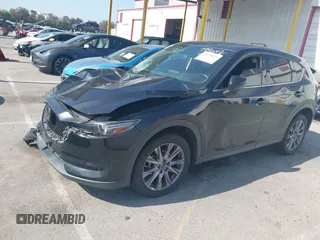 2019 Mazda CX-5 Grand Touring with VIN JM3KFADMXK1547727, listed as a IAAI auction lot 42138071 with Not provided miles and . Bid and sale history available at DreamBid. Image 17.