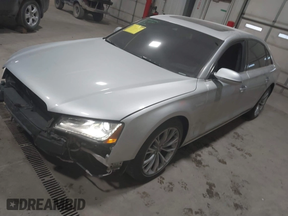 2011 Audi A8 with VIN WAURVAFD5BN014214, listed as a IAAI auction lot 41396044 with 131,764 mi miles and . Bid and sale history available at DreamBid. Image 2.