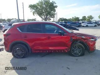 2020 Mazda CX-5 Touring with VIN JM3KFACMXL1819518, listed as a IAAI auction lot 41911679 with 50,357 mi miles and . Bid and sale history available at carsss.com. Image 14.