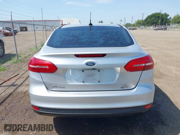 2018 Ford Focus SE z VIN 1FADP3FE0JL321530, wystawiony jako IAAI lot #42275532 z przebiegiem 65 412 mil mil oraz . Historia ofert i sprzedaży dostępna na DreamBid. Obrazek 16.