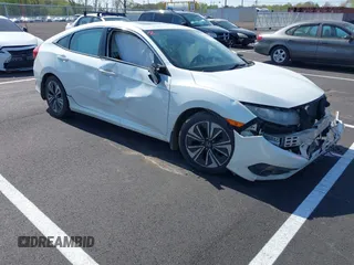 2016 Honda Civic Sedan EX-T with VIN 19XFC1F38GE004341, listed as a IAAI auction lot 41898993 with 234,259 mi miles. Bid and sale history available at carsss.com. Image 1.