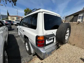 2000 Mitsubishi Montero z VIN JA4MR51R6YJ002305, wystawiony jako Copart lot #50263015 z przebiegiem 138 861 mil mil oraz Czysty tytuł • Clean title. Historia ofert i sprzedaży dostępna na DreamBid. Obrazek 3.