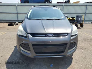 2015 Ford Escape Titanium z VIN 1FMCU9J97FUA38731, wystawiony jako Copart lot #60621085 z przebiegiem 119 704 mil mil oraz Szkoda całkowita • Salvage title. Historia ofert i sprzedaży dostępna na DreamBid. Obrazek 5.