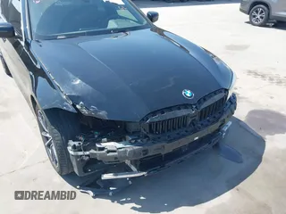2019 BMW 3 Series 330i with VIN WBA5R1C51KFH09402, listed as a IAAI auction lot 41869138 with 59,115 mi miles and . Bid and sale history available at DreamBid. Image 6.