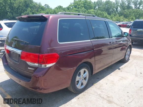 2010 Honda Odyssey Touring z VIN 5FNRL3H92AB010292, wystawiony jako IAAI lot #42469216 z przebiegiem 188 921 mil mil oraz . Historia ofert i sprzedaży dostępna na DreamBid. Obrazek 4.