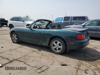 2000 Mazda MX-5 Miata with VIN JM1NB3533Y0151883, listed as a Copart auction lot 64423925 with 180,275 mi miles and Salvage title. Bid and sale history available at DreamBid. Image 2.