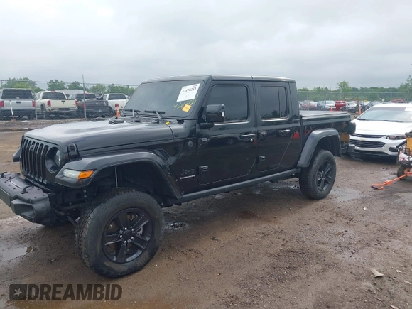 2023 Jeep Gladiator Overland with VIN 1C6JJTFM9PL593659, listed as a IAAI auction lot 42470253 with 34,374 mi miles and . Bid and sale history available at DreamBid. Image 2.