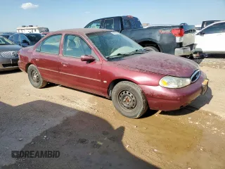1999 Ford Contour LX with VIN 1FAFP66L2XK167281, listed as a Copart auction lot 64839335 with 256,227 mi miles and Clean title. Bid and sale history available at DreamBid. Image 4.