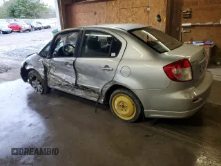 2010 Suzuki SX4 with VIN JS2YC5A49A6310256, listed as a Copart auction lot 73210584 with 135,021 mi miles and Salvage Title. Bid and sale history available at DreamBid. Image 2.