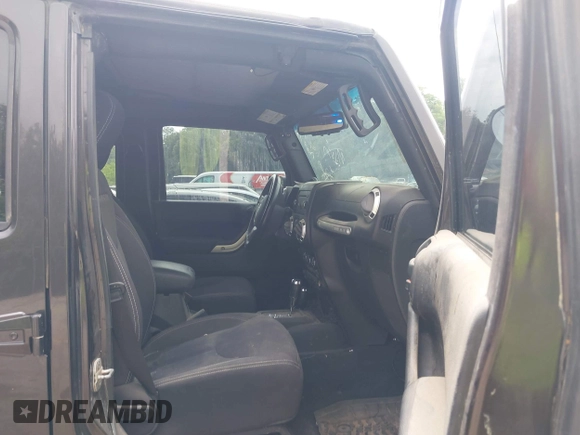 2013 Jeep Wrangler Unlimited Rubicon with VIN 1C4BJWFG5DL652050, listed as a IAAI auction lot 42451954 with 107,110 mi miles and . Bid and sale history available at DreamBid. Image 5.
