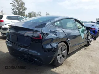 2023 Tesla Model 3 with VIN 5YJ3E1EA0PF518904, listed as a IAAI auction lot 42058540 with 20,945 mi miles and . Bid and sale history available at DreamBid. Image 4.