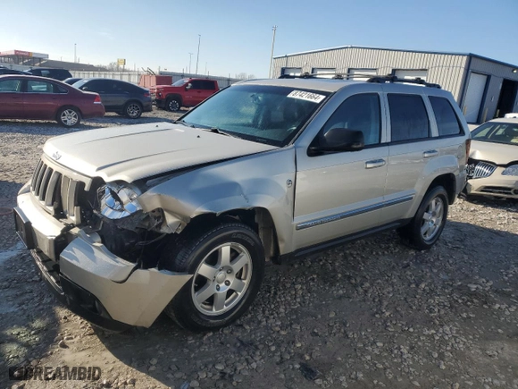2010 Jeep Grand Cherokee Laredo with VIN 1J4RR4GT1AC106990, listed as a Copart auction lot 87421664 with 106,025 mi miles and Salvage Title. Bid and sale history available at carsss.com. Image 1.
