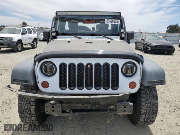 2013 Jeep Wrangler Unlimited Sport with VIN 1C4BJWDG8DL639781, listed as a Copart auction lot 63620025 with 84,720 mi miles and Salvage title. Bid and sale history available at DreamBid. Image 5.