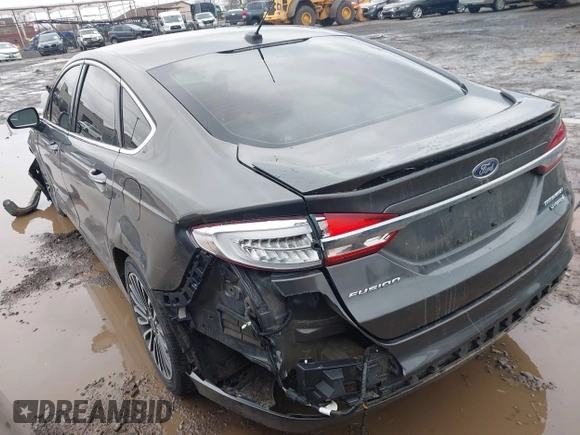 2017 Ford Fusion Hybrid Titanium z VIN 3FA6P0RU6HR279726, wystawiony jako IAAI lot #41736889 z przebiegiem 123 698 mil mil oraz . Historia ofert i sprzedaży dostępna na DreamBid. Obrazek 3.