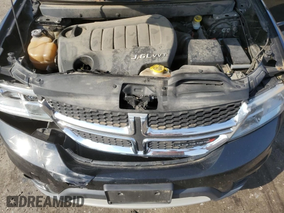 2013 Dodge Journey SXT with VIN 3C4PDCBG4DT619319, listed as a Copart auction lot 62964135 with 140,620 mi miles and Salvage title. Bid and sale history available at DreamBid. Image 12.