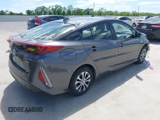 2021 Toyota Prius LE with VIN JTDKAMFP3M3193640, listed as a IAAI auction lot 42023593 with 17,841 mi miles and . Bid and sale history available at DreamBid. Image 4.