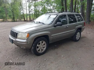 1999 Jeep Grand Cherokee Limited with VIN 1J4GW68N5XC684157, listed as a IAAI auction lot 42104283 with 164,506 mi miles. Bid and sale history available at carsss.com. Image 2.