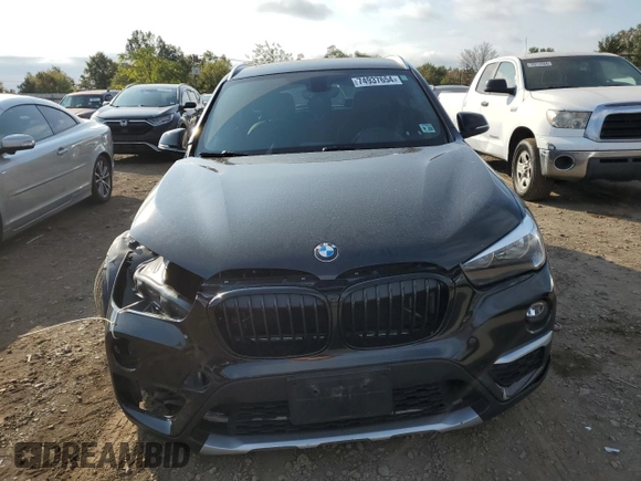 2018 BMW X1 xDrive28i with VIN WBXHT3C33J5F90612, listed as a Copart auction lot 74937654 with 72,561 mi miles and Salvage Title. Bid and sale history available at carsss.com. Image 5.