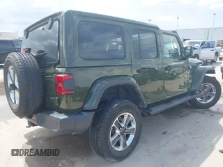 2022 Jeep Wrangler Unlimited Sahara Altitude with VIN 1C4HJXEG3NW194042, listed as a IAAI auction lot 42643314 with 32,091 mi miles and . Bid and sale history available at DreamBid. Image 4.