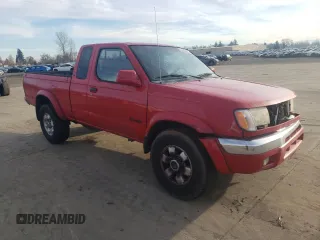 1999 Nissan Frontier XE with VIN 1N6ED26Y2XC312863, listed as a Copart auction lot 42259015 with 212,666 mi miles and Salvage title. Bid and sale history available at DreamBid. Image 4.
