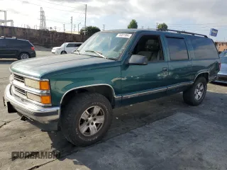 1997 Chevrolet Suburban with VIN 3GNFK16R4VG163602, listed as a Copart auction lot 76081984 with 243,169 mi miles and Salvage Title. Bid and sale history available at carsss.com. Image 1.