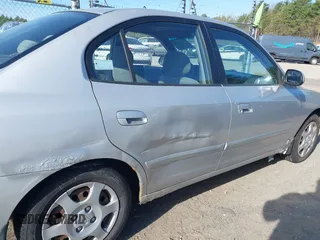 2003 Hyundai Elantra GLS z VIN KMHDN45D23U700908, wystawiony jako IAAI lot #42133529 z przebiegiem 100 955 mil mil oraz . Historia ofert i sprzedaży dostępna na DreamBid. Obrazek 6.