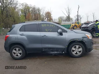 2015 Chevrolet Trax LT with VIN KL7CJRSBXFB097960, listed as a IAAI auction lot 41976883 with 98,621 mi miles and . Bid and sale history available at carsss.com. Image 13.