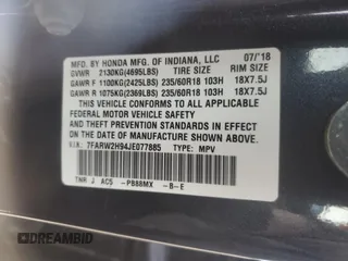 2018 Honda CR-V Touring z VIN 7FARW2H94JE077885, wystawiony jako Copart lot #55451345 z przebiegiem 133 964 mil mil oraz Szkoda całkowita • Salvage title. Historia ofert i sprzedaży dostępna na DreamBid. Obrazek 12.