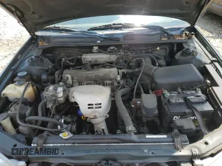 2000 Toyota Camry CE z VIN 4T1BG22K0YU708702, wystawiony jako Copart lot #56755285 z przebiegiem 318 734 mil mil oraz Szkoda całkowita • Salvage title. Historia ofert i sprzedaży dostępna na DreamBid. Obrazek 11.