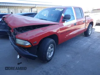 2000 Dodge Dakota Sport with VIN 1B7GL2AZ4YS722151, listed as a Copart auction lot 87870705 with 169,435 mi miles and Salvage Title. Bid and sale history available at DreamBid. Image 1.