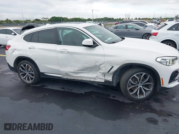 2020 BMW X4 xDrive30i z VIN 5UX2V1C02LLE68148, wystawiony jako IAAI lot #42253362 z przebiegiem 80 865 mil mil oraz . Historia ofert i sprzedaży dostępna na DreamBid. Obrazek 13.