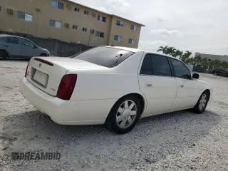 2003 Cadillac DeVille DTS z VIN 1G6KF57973U204531, wystawiony jako Copart lot #45712115 z przebiegiem 107 737 mil mil oraz Szkoda całkowita • Salvage title. Historia ofert i sprzedaży dostępna na DreamBid. Obrazek 3.