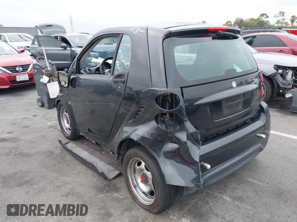 2013 Smart fortwo Pure with VIN WMEEJ3BA1DK651627, listed as a IAAI auction lot 42733791 with 130,561 mi miles and . Bid and sale history available at DreamBid. Image 3.