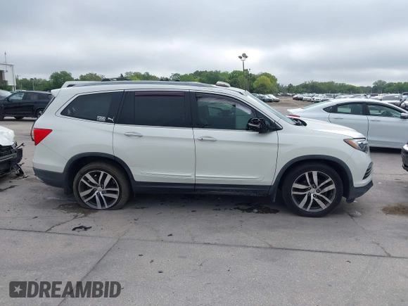 2016 Honda Pilot Elite with VIN 5FNYF6H00GB104329, listed as a IAAI auction lot 41905390 with 125,501 mi miles. Bid and sale history available at carsss.com. Image 13.