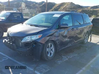 2015 Toyota Sienna LE AAS with VIN 5TDKK3DC3FS529845, listed as a IAAI auction lot 41627102 with 130,334 mi miles. Bid and sale history available at carsss.com. Image 2.