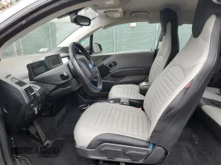 2017 BMW i3 z VIN WBY1Z8C38HV890419, wystawiony jako Copart lot #52199865 z przebiegiem Nie podano mil oraz Szkody całkowita. Historia ofert i sprzedaży dostępna na DreamBid. Obrazek 7.
