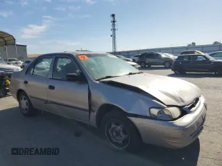 1998 Toyota Corolla VE with VIN 1NXBR12E3WZ093073, listed as a Copart auction lot 58270705 with 303,875 mi miles and Salvage title. Bid and sale history available at DreamBid. Image 4.