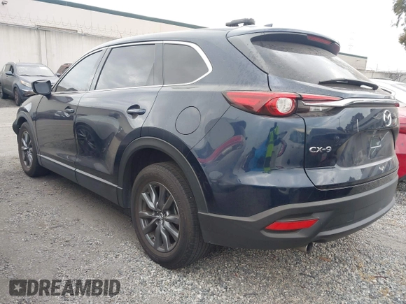 2021 Mazda CX-9 Touring with VIN JM3TCACY9M0526880, listed as a IAAI auction lot 42310923 with 25,991 mi miles and . Bid and sale history available at DreamBid. Image 3.