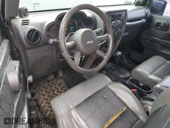 2009 Jeep Wrangler X with VIN 1J4FA241X9L735743, listed as a Copart auction lot 48109455 with 232,110 mi miles and Salvage Title. Bid and sale history available at DreamBid. Image 8.