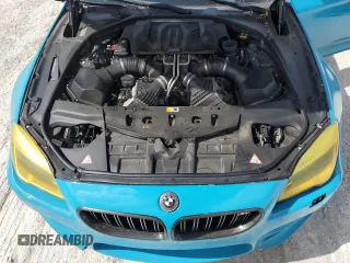 2016 BMW M6 z VIN WBS6E9C51GG437085, wystawiony jako Copart lot #78982124 z przebiegiem Nie podano mil oraz Szkody całkowita. Historia ofert i sprzedaży dostępna na DreamBid. Obrazek 11.