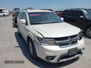 2014 Dodge Journey SXT with VIN 3C4PDCBGXET118758, listed as a IAAI auction lot 42020676 with 165,563 mi miles. Bid and sale history available at carsss.com. Image 1.