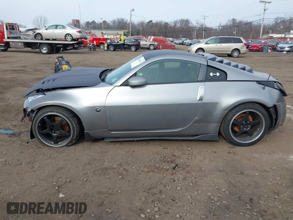 2003 Nissan 350Z Touring z VIN JN1AZ34E33T003711, wystawiony jako IAAI lot #41351191 z przebiegiem 167 503 mil mil oraz . Historia ofert i sprzedaży dostępna na DreamBid. Obrazek 14.
